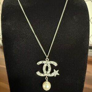 CHANEL (authentic) COCO Mark rhinestone necklace, silver tone with faux pearl.
